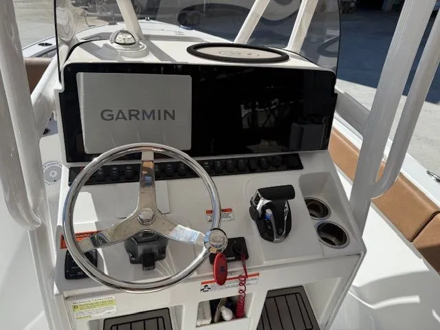 Slide: The Image of 2022 Sea Hunt 234 boat helm with Garmin navigation system. - 17