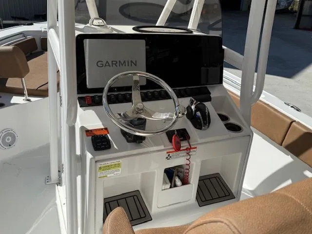Slide: The Image of Helm of a 2022 Sea Hunt 234 boat with Garmin navigation system. - 9
