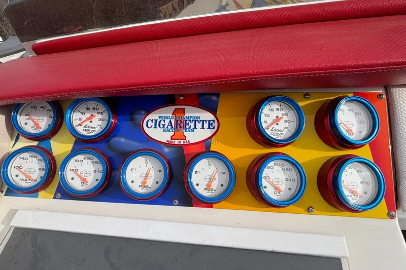 Slide: The Image of Dashboard of 2003 Cigarette 38' Top Gun boat with gauges and branding. - 20