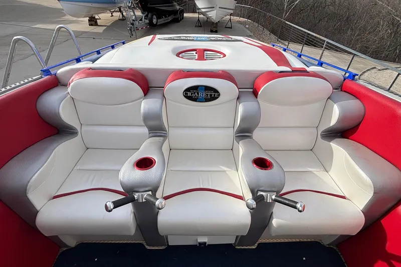 Slide: The Image of 2003 Cigarette 38' Top Gun boat interior with red and white seating. - 35