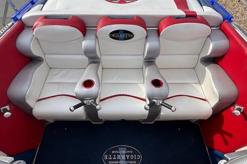 Slide: The Image of 2003 Cigarette 38' Top Gun boat interior with red and white seating. - 9