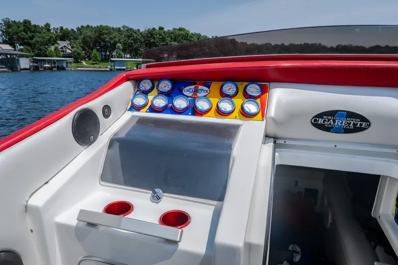 Slide: The Image of Dashboard of a 2003 Cigarette 38' Top Gun boat with gauges and branding. - 15