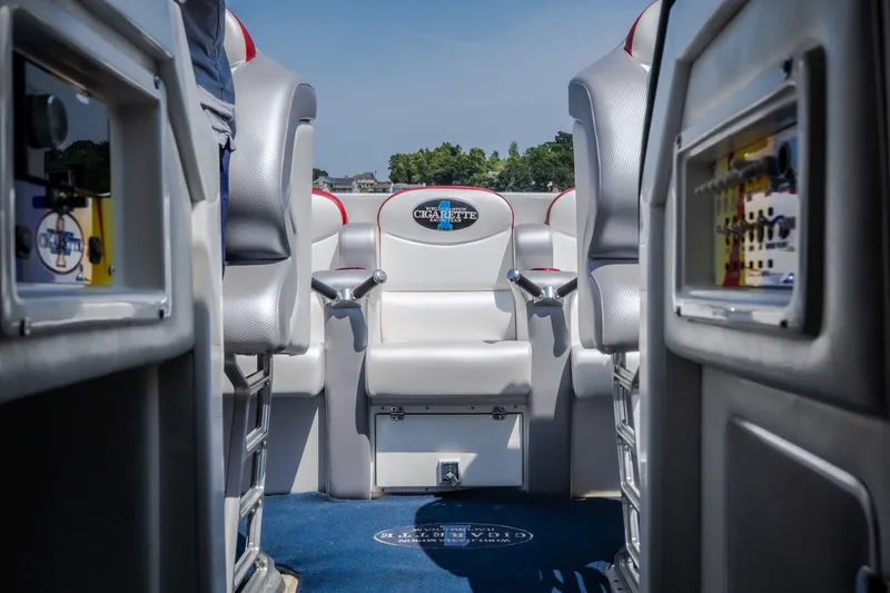 Slide: The Image of Interior of a 2003 Cigarette 38' Top Gun boat with sleek seating and control panels. - 22