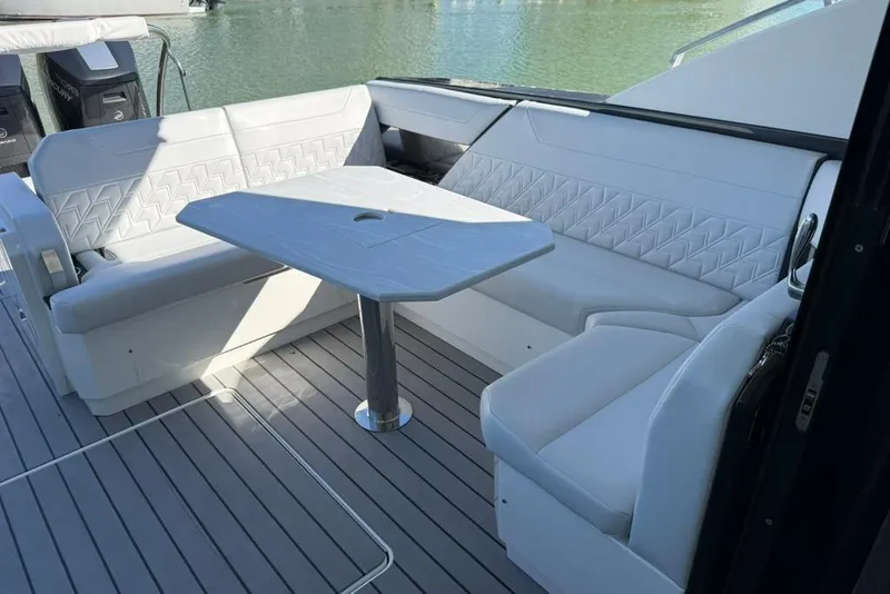 Slide: The Image of 2022 Formula 500 Super Sport Crossover luxury boat docked in sunny marina. - 12