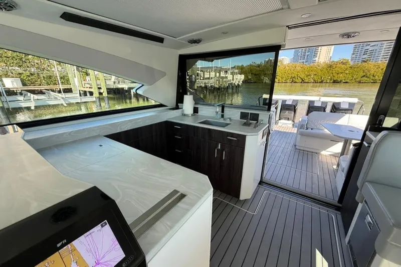 Slide: The Image of Luxurious interior of 2022 Formula 500 Super Sport Crossover yacht with sleek seating and table. - 17