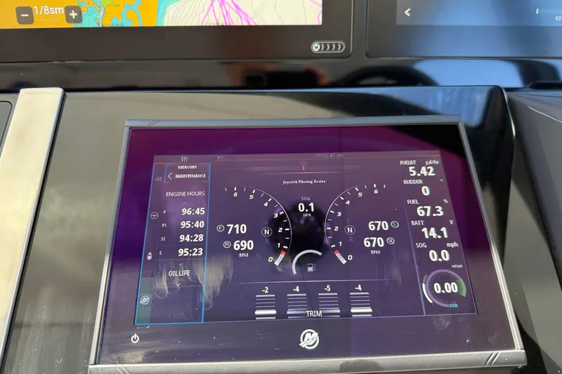 Slide: The Image of Dashboard of 2022 Formula 500 Super Sport Crossover displaying engine and navigation data. - 2