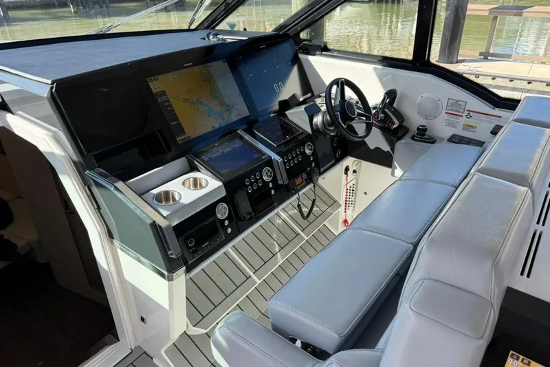 Slide: The Image of Interior of 2022 Formula 500 Super Sport Crossover yacht with modern seating and kitchenette. - 25