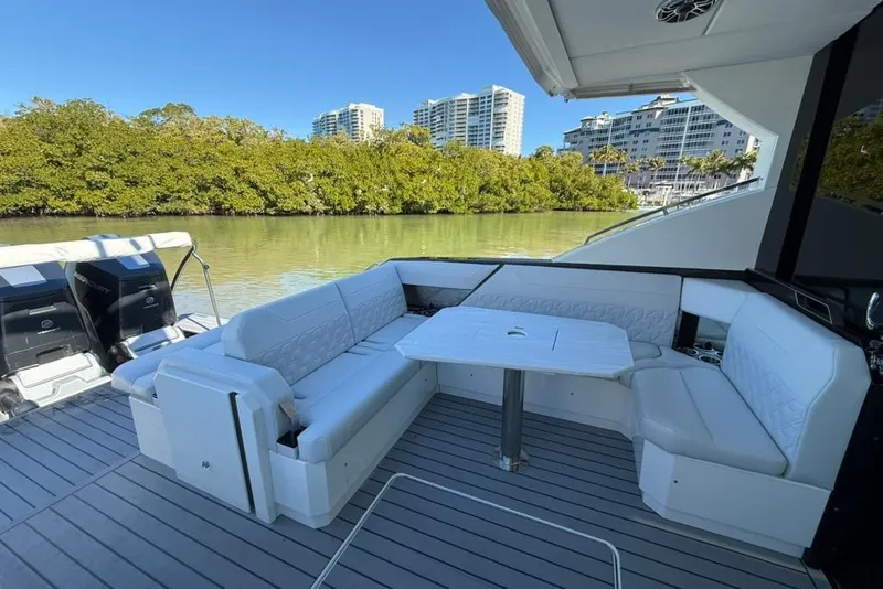 Slide: The Image of 2022 Formula 500 Super Sport Crossover yacht with sleek seating and waterfront view. - 5