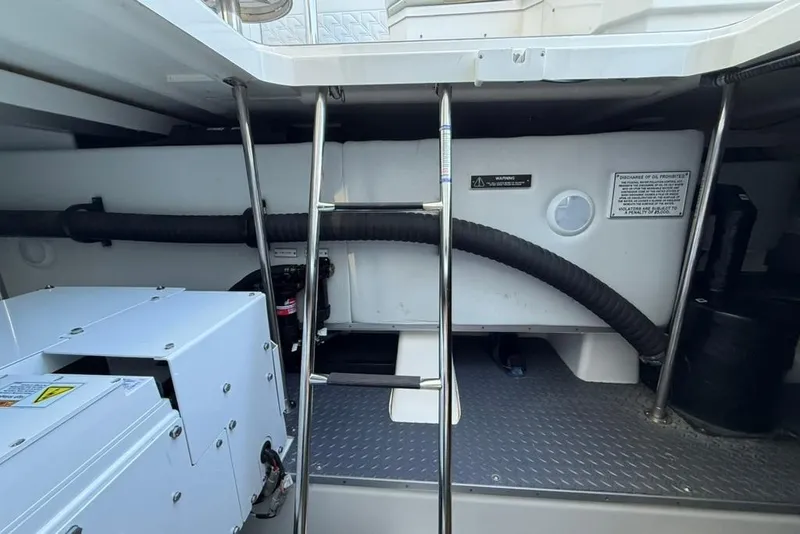 Slide: The Image of 2022 Formula 500 Super Sport Crossover engine room with fire extinguisher and equipment. - 50