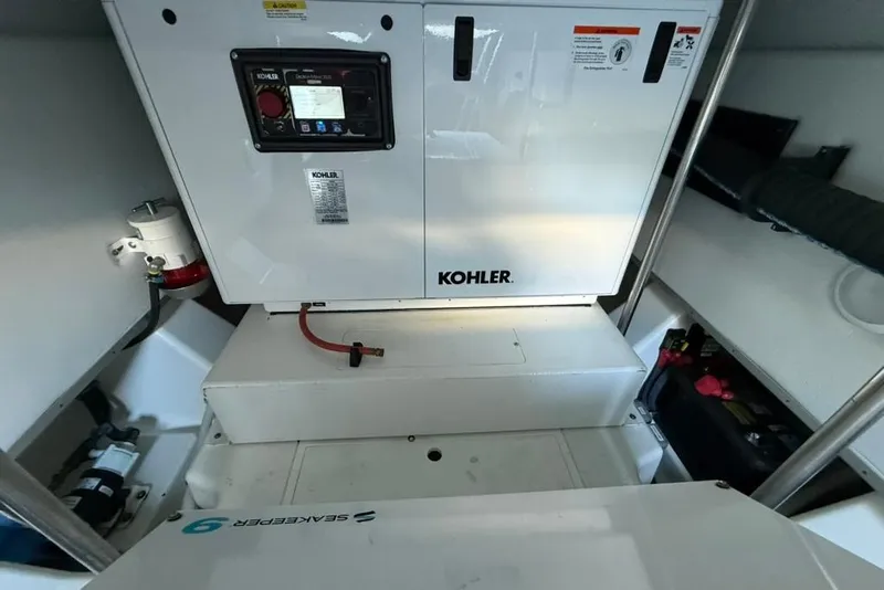 Slide: The Image of Modern kitchen interior in 2022 Formula 500 Super Sport Crossover boat, featuring sleek cabinetry and appliances. - 55