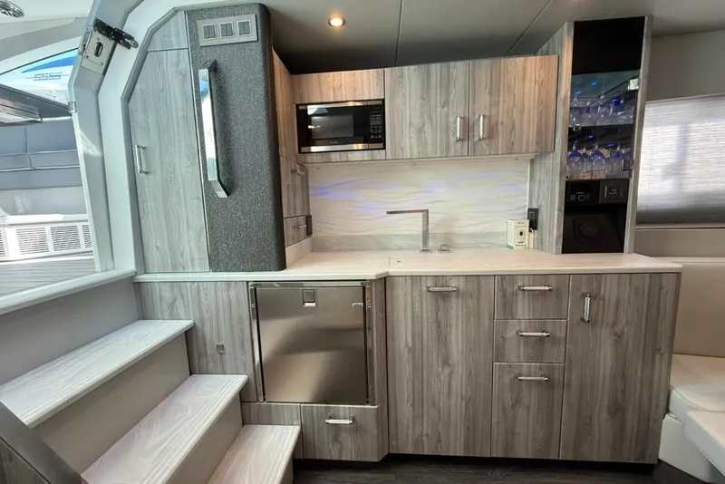 Slide: The Image of Interior of 2022 Formula 500 Super Sport Crossover with modern seating and sleek cabinetry. - 57