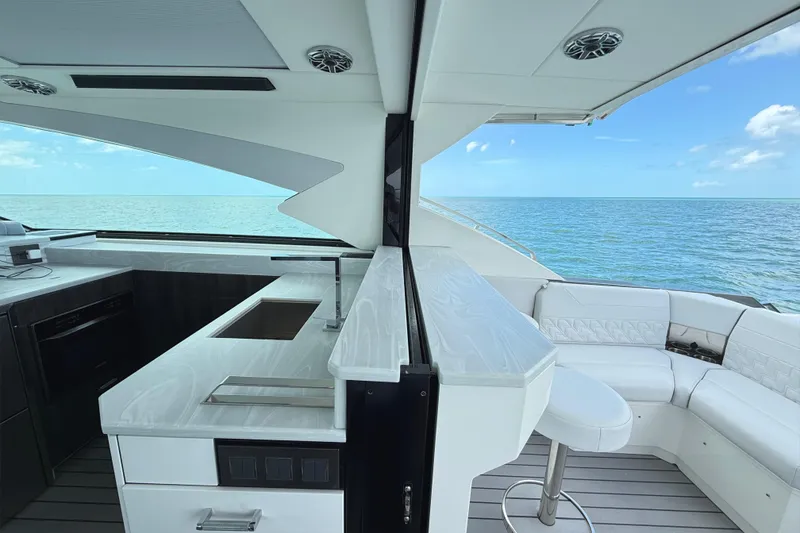 Slide: The Image of Engine compartment of 2022 Formula 500 Super Sport Crossover with fire extinguisher and equipment. - 78