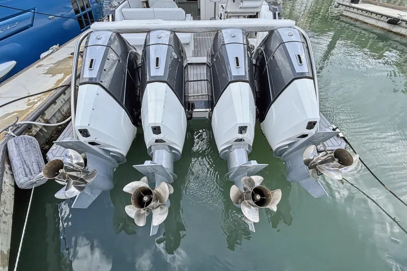 Slide: The Image of Four powerful outboard motors on a 2022 Formula 500 Super Sport Crossover boat. - 83