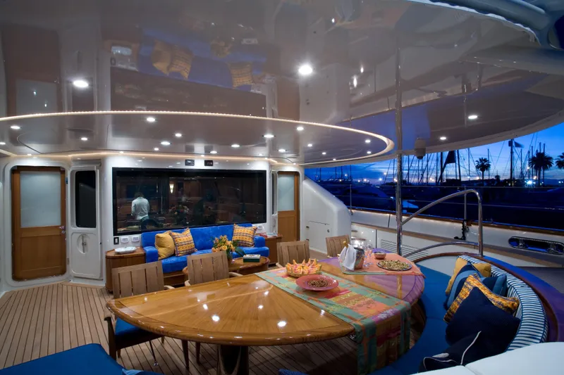 Slide: The Image of Luxurious 2007 Perini Navi 52M yacht deck with elegant dining area at sunset. - 16