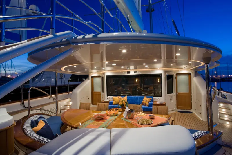 Slide: The Image of Luxurious 2007 Perini Navi 52M yacht deck with elegant dining area at sunset. - 17