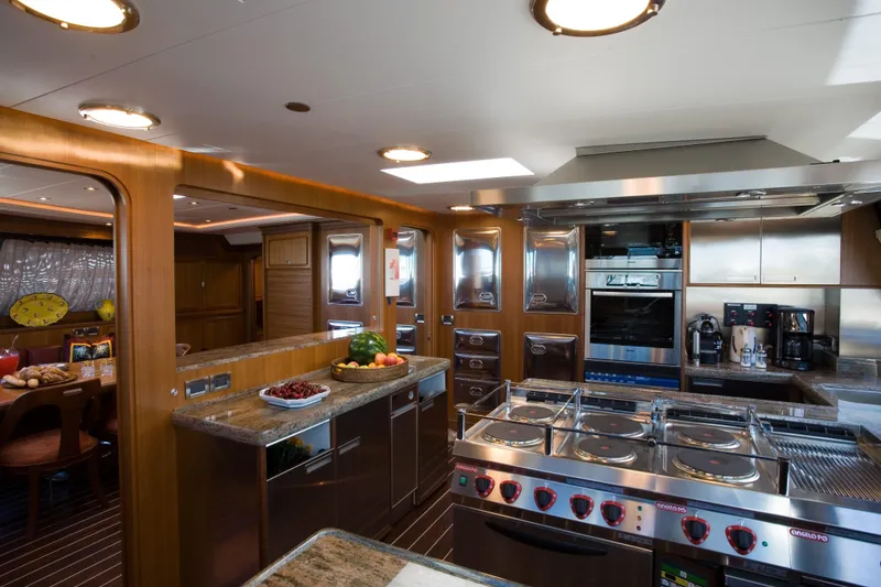 Slide: The Image of Luxurious kitchen interior on 2007 Perini Navi 52M yacht, featuring modern appliances and elegant design. - 25