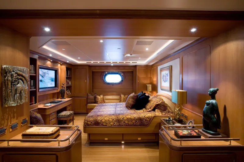 Slide: The Image of Luxurious 2007 Perini Navi 52M yacht bedroom with elegant wood paneling and sophisticated decor. - 26