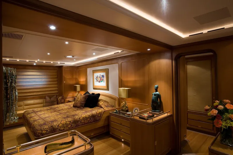 Slide: The Image of Luxurious bedroom interior on 2007 Perini Navi 52M yacht, featuring elegant wood paneling and ambient lighting. - 27