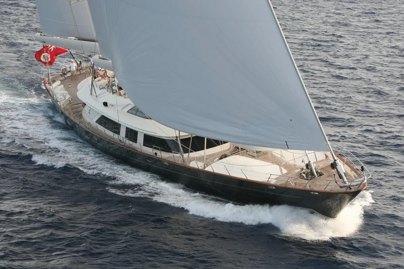 Slide: The Image of Luxurious 2007 Perini Navi 52M yacht sailing on open sea with full sails. - 3