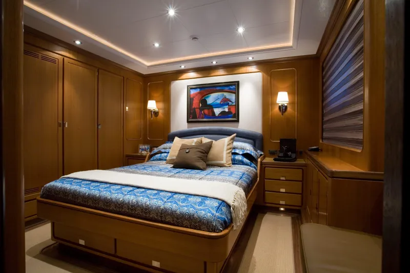 Slide: The Image of Luxurious bedroom interior on 2007 Perini Navi 52M yacht, featuring elegant wood paneling and modern decor. - 33