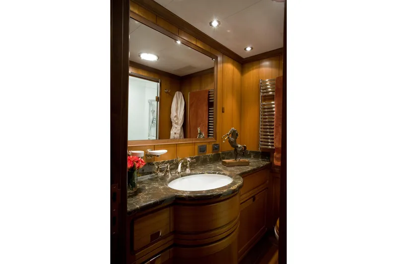 Slide: The Image of Luxurious bathroom on 2007 Perini Navi 52M yacht with marble countertop and elegant wood finishes. - 38