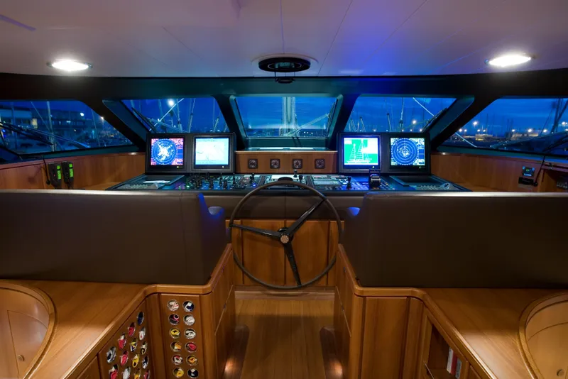 Slide: The Image of Luxurious 2007 Perini Navi 52M yacht cockpit with advanced navigation systems and wooden interior. - 41