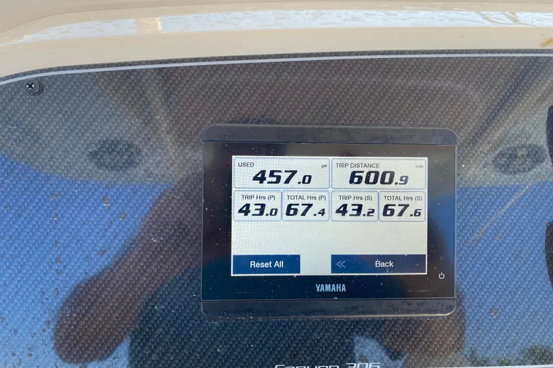 Slide: The Image of Dashboard of 2024 Grady-White Canyon 306 showing trip data and fuel usage. - 14