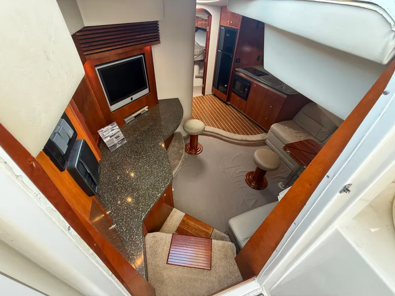 Slide: The Image of Interior of the 2007 Cruisers Yachts 420 Express with elegant kitchen and cozy living area. - 41