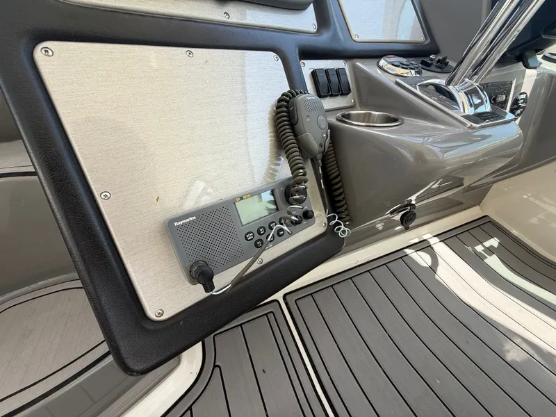 Slide: The Image of The image shows the cockpit of a 2007 Cruisers Yachts 420 Express with a radio. - 28