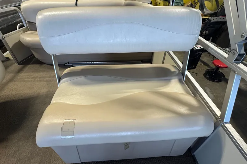 Slide: The Image of 2007 Sun Tracker Party Barge 18 Signature Series beige seating in a boat interior. - 12