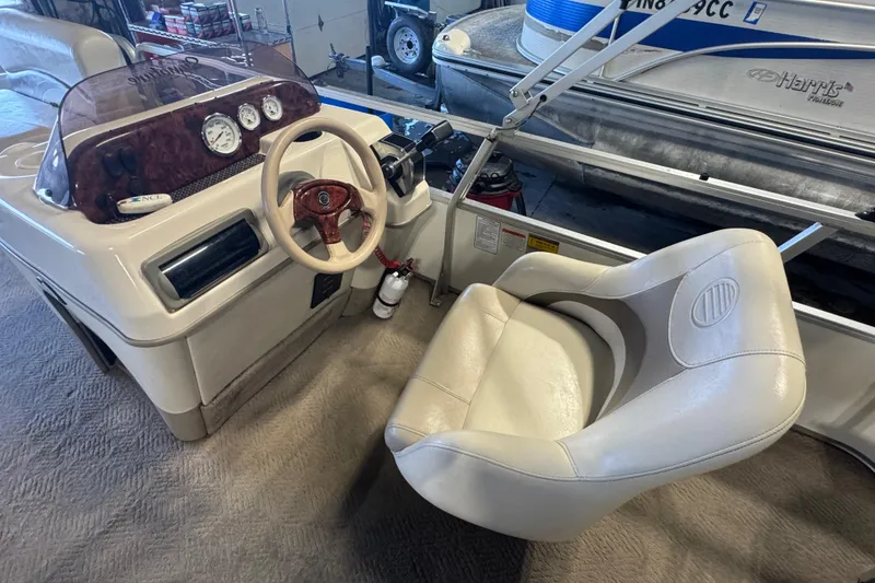 Slide: The Image of 2007 Sun Tracker Party Barge 18 Signature Series boat interior with steering console and captain's chair. - 13