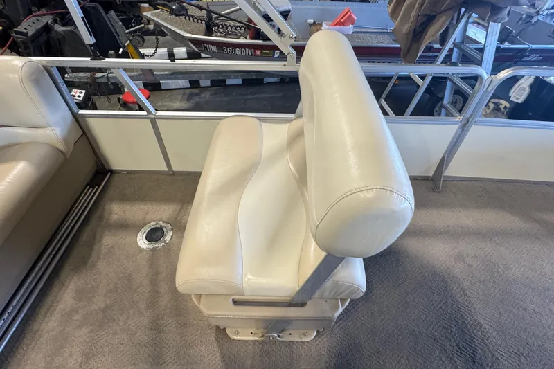 Slide: The Image of 2007 Sun Tracker Party Barge 18 Signature Series boat seat, beige upholstery, interior view. - 14