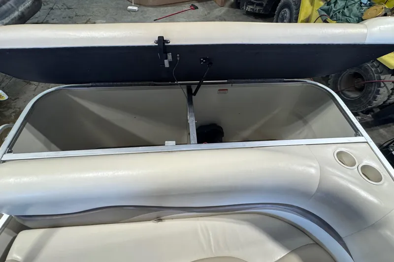 Slide: The Image of Open storage compartment in 2007 Sun Tracker Party Barge 18 Signature Series boat. - 18