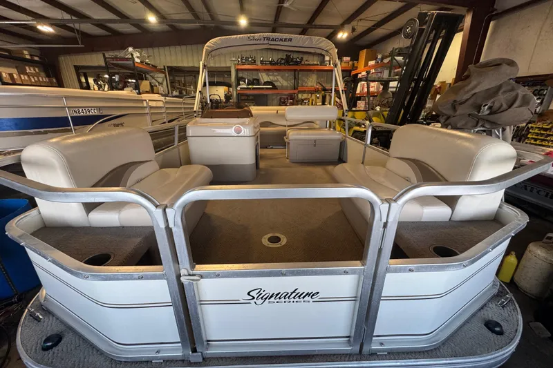 Slide: The Image of 2007 Sun Tracker Party Barge 18 Signature Series pontoon boat in a storage facility. - 7
