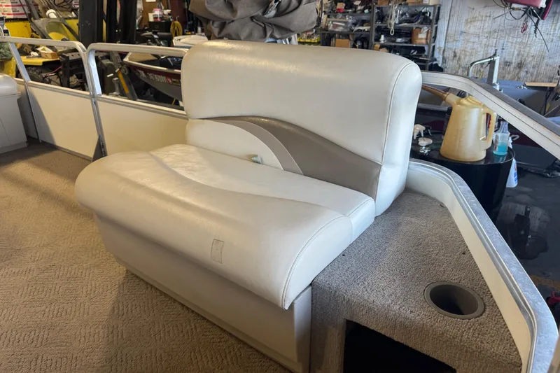 Slide: The Image of 2007 Sun Tracker Party Barge 18 Signature Series boat seat in a workshop setting. - 9