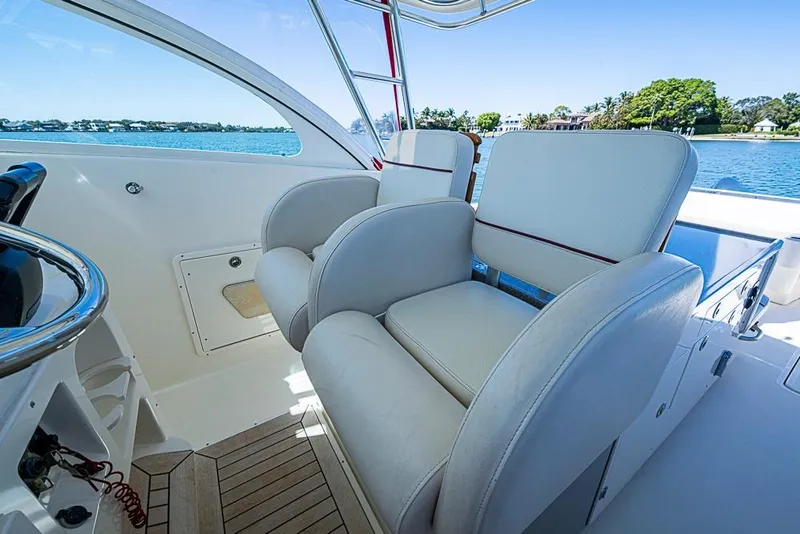 Slide: The Image of Interior of 2006 Pursuit 345 Drummond Runner LS boat with plush seating and ocean view. - 10