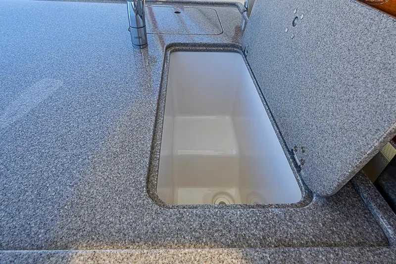 Slide: The Image of Granite countertop with open sink on 2006 Pursuit 345 Drummond Runner LS boat. - 14