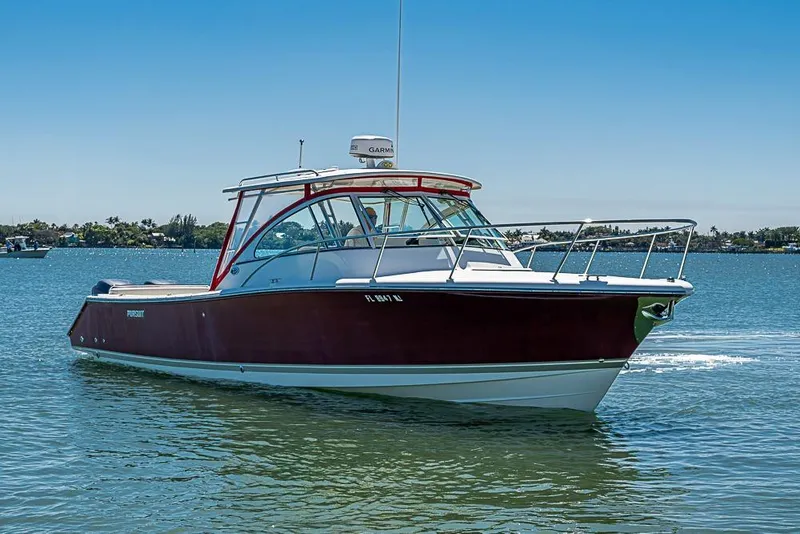 Slide: The Image of 2006 Pursuit 345 Drummond Runner LS boat cruising on a sunny day. - 4