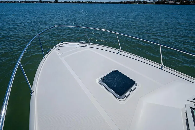 Slide: The Image of Bow view of 2006 Pursuit 345 Drummond Runner LS on calm water. - 5