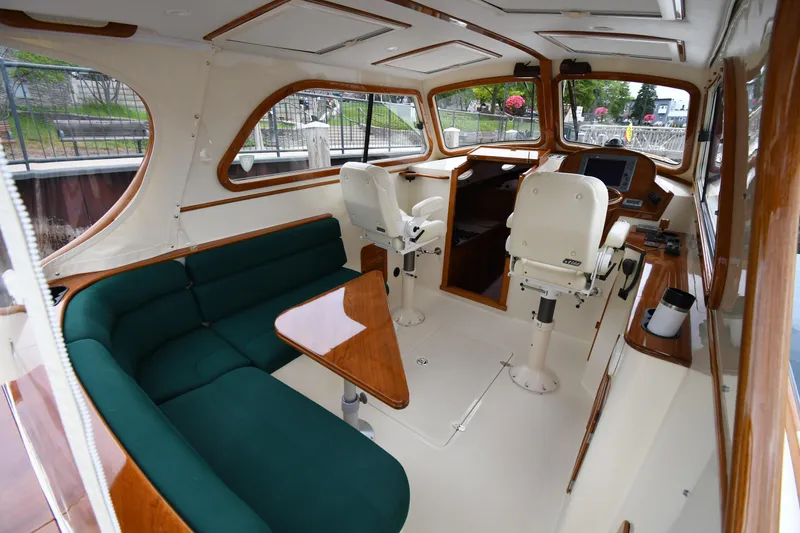 Slide: The Image of Interior of 2005 Hinckley Picnic Boat 36 EP with seating and helm station. - 15