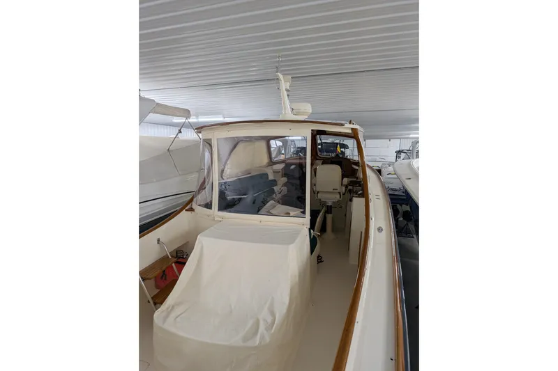 Slide: The Image of 2005 Hinckley Picnic Boat 36 Classic EP in storage, showcasing elegant design and craftsmanship. - 18