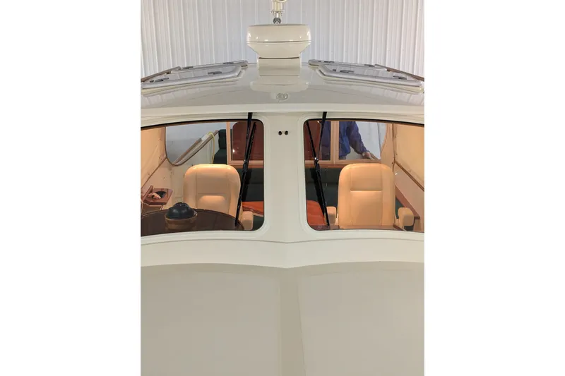 Slide: The Image of 2005 Hinckley Picnic Boat 36 EP interior view with helm and seating. - 21