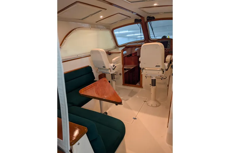 Slide: The Image of Interior of 2005 Hinckley Picnic Boat 36 EP with seating and helm station. - 25