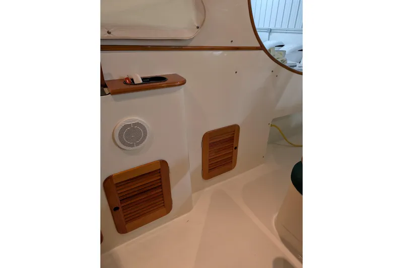 Slide: The Image of Interior view of 2005 Hinckley Picnic Boat 36 EP with wooden accents and speaker. - 29