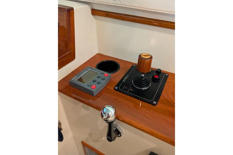 Slide: The Image of Control panel of 2005 Hinckley Picnic Boat 36 Classic EP with joystick and display. - 35