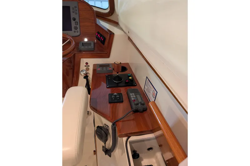 Slide: The Image of Helm station of 2005 Hinckley Picnic Boat 36 EP with controls and navigation equipment. - 36