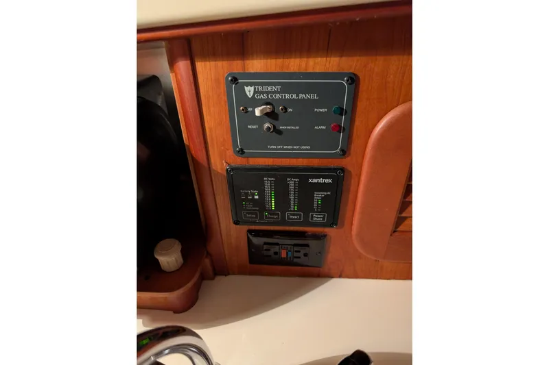 Slide: The Image of Control panels on 2005 Hinckley Picnic Boat 36 Classic EP, featuring Trident gas and Xantrex systems. - 37