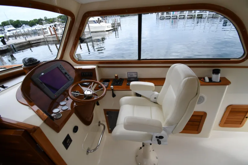 Slide: The Image of Helm of 2005 Hinckley Picnic Boat 36 EP with steering wheel and navigation equipment. - 19