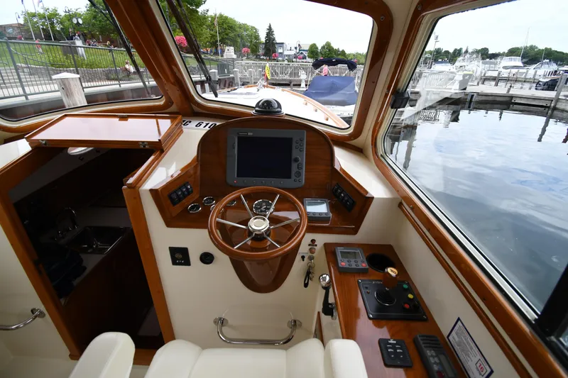 Slide: The Image of Interior view of 2005 Hinckley Picnic Boat 36 EP helm with wooden steering wheel. - 20
