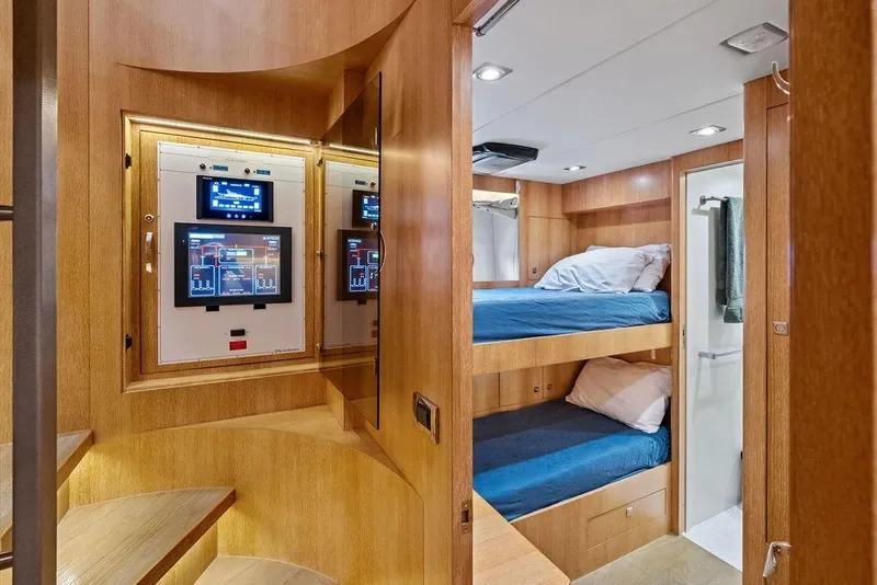 Slide: The Image of Luxurious 2014 Horizon RP 110 yacht interior with bunk beds and control panels. - 100